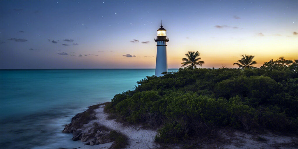 A serene beach view with the Cape Florida Lighthouse in the background.